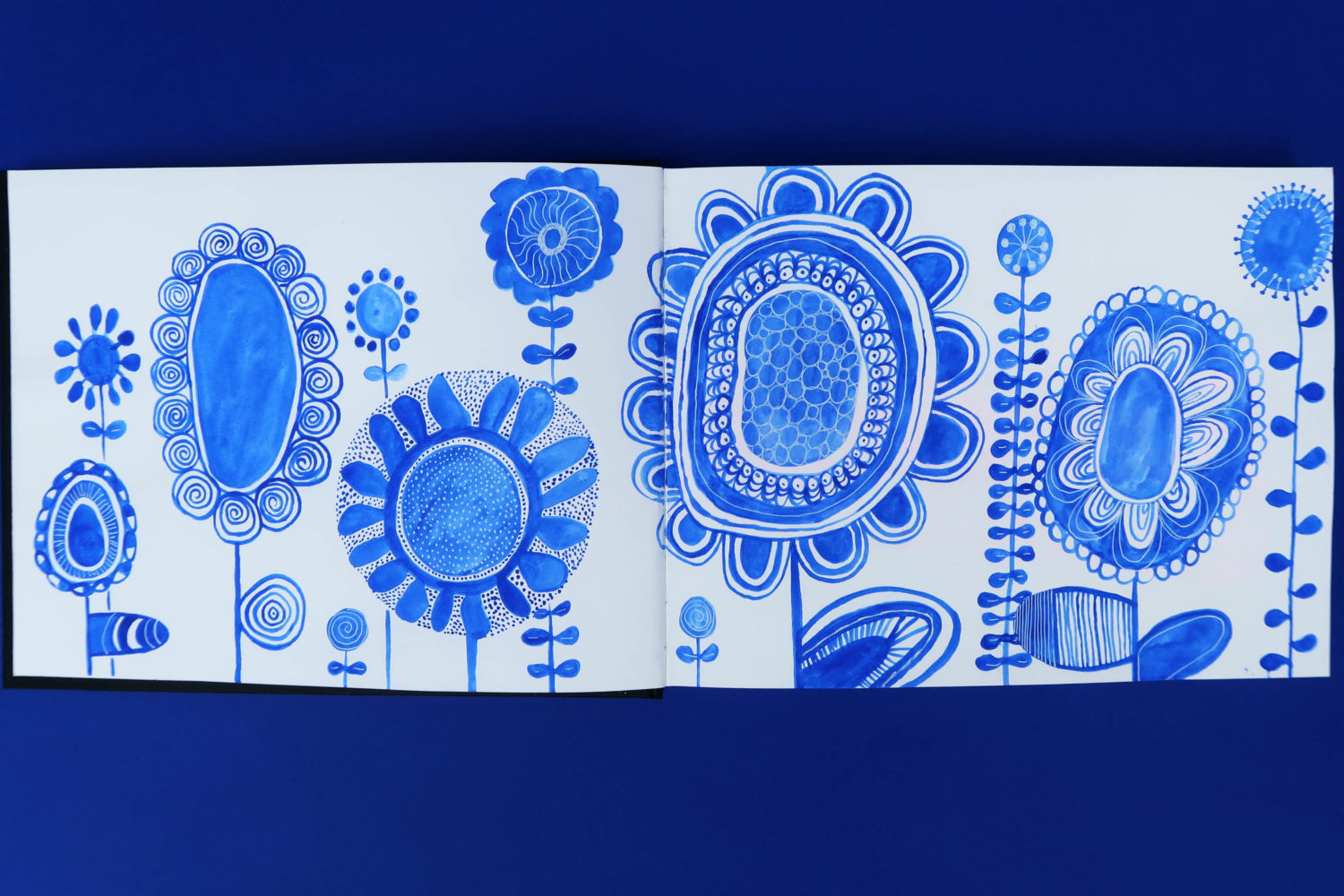 Painting of flowers with blue watercolor